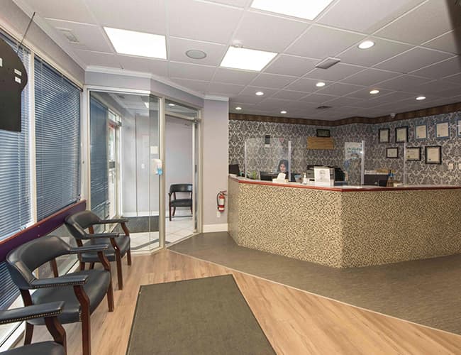 Physical barrier at reception desk - London Square Dental Calgary